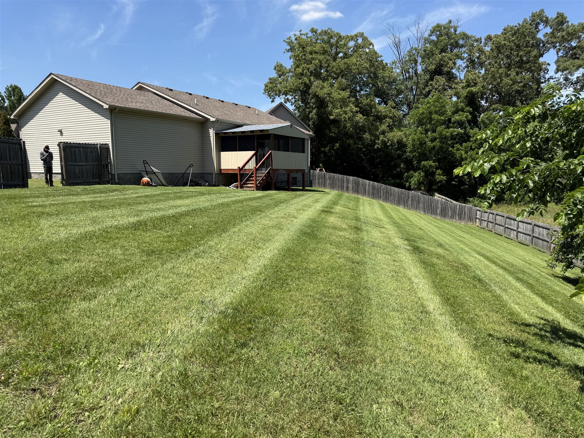 Big Chief lawn care residential backyard with fence in South Central Kentucky