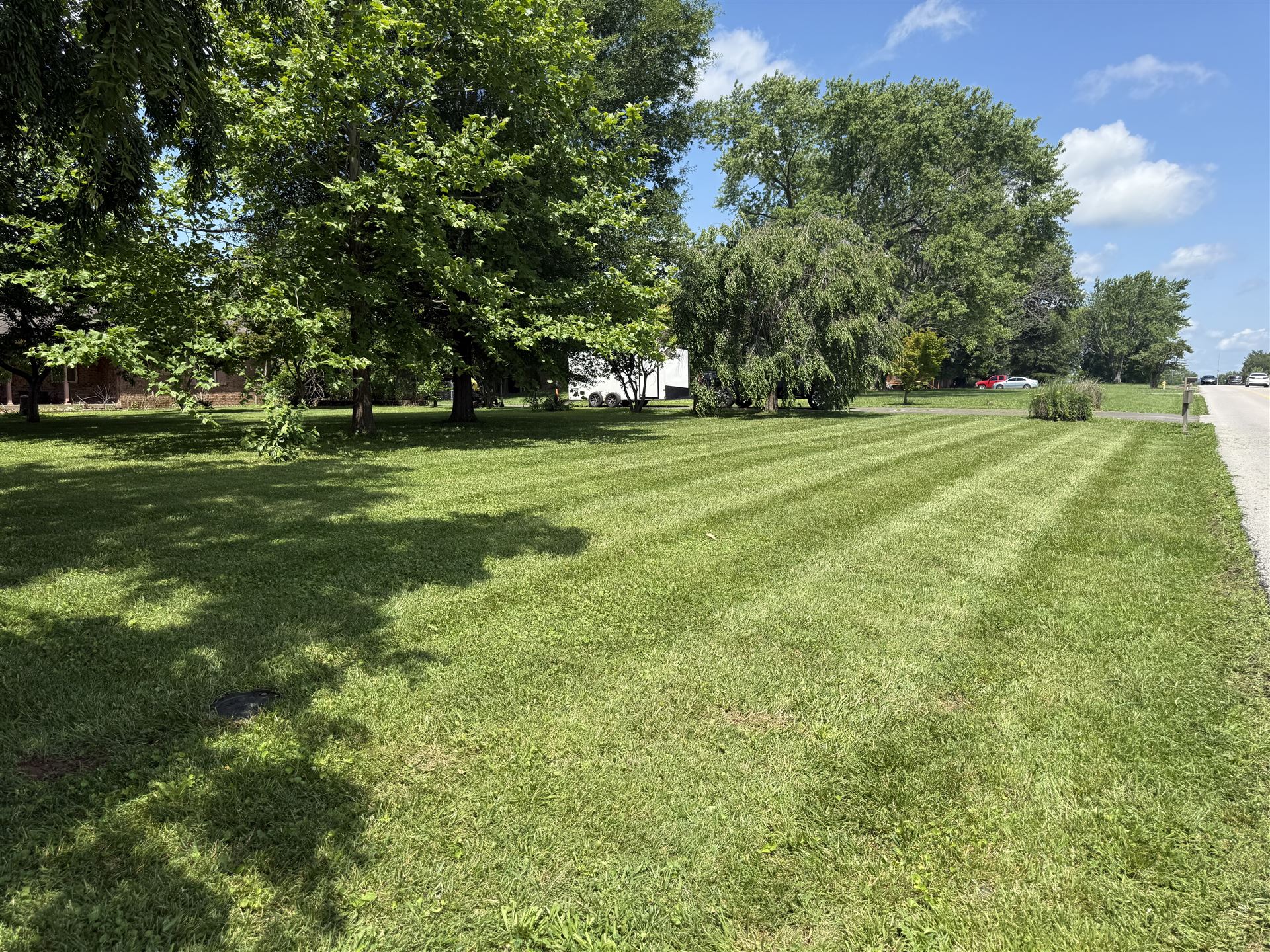 Big Chief lawn mowing at rural roadside property in Kentucky