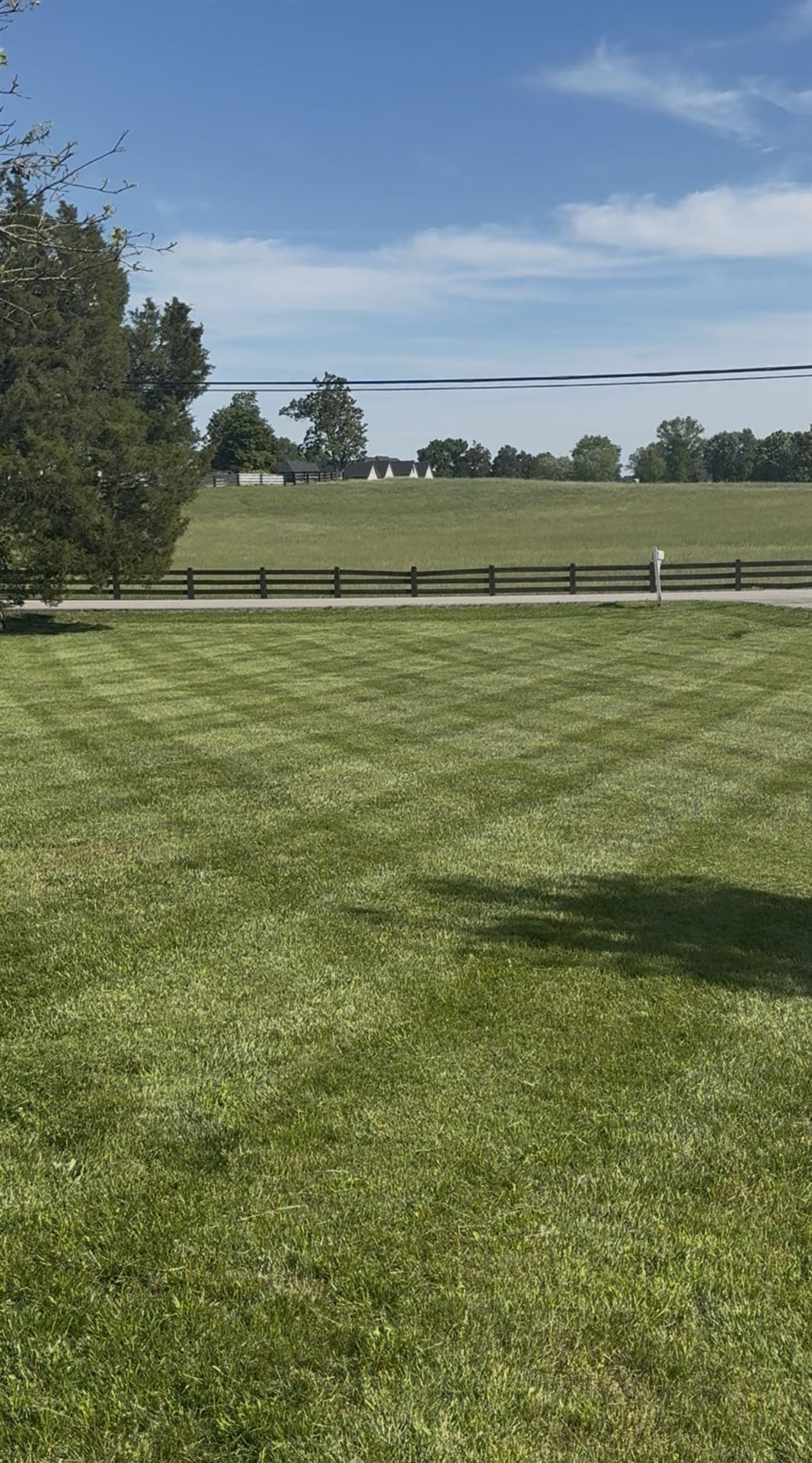 Big Chief lawn mowing at rural property with fence in South Central Kentucky
